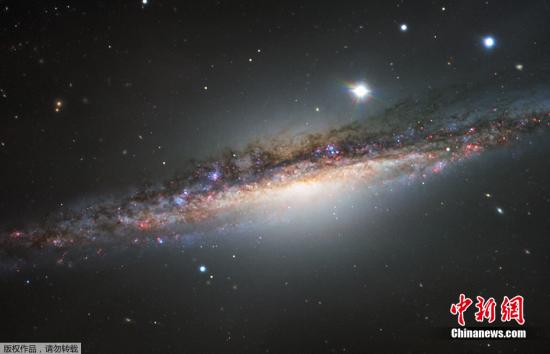 鲸鱼座NGC1055星系图像。资料图 鲸鱼座NGC1055星系图像。资料图